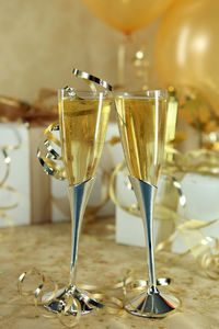 Close-up of wine glasses on table