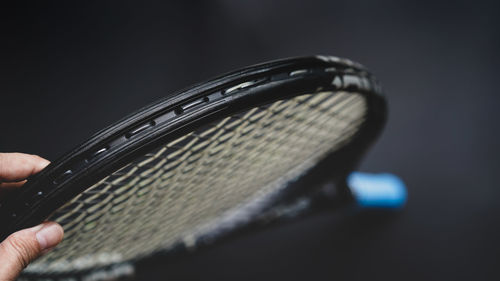 Cropped hand of woman holding sunglasses