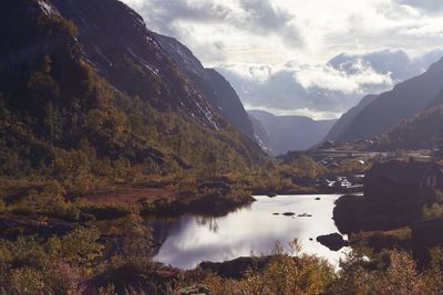 Scenic view of lake and mountains against sky