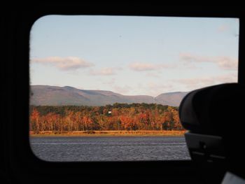 Scenic view of mountains seen through window
