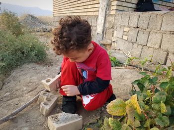 Boy playing with brick