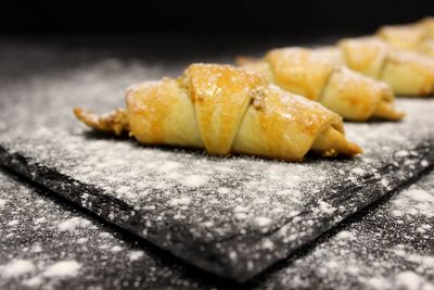 Close-up of croissants on slate