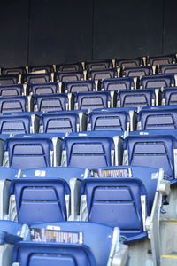 Empty chairs arranged in row