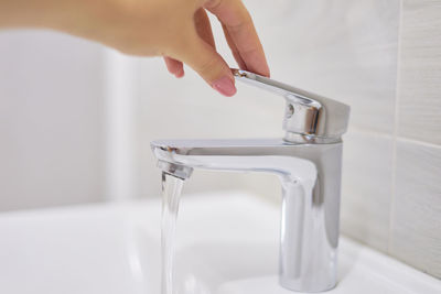 Close-up of person holding glass