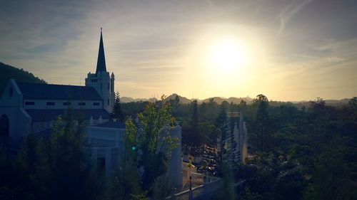 Panoramic shot of city against sky at sunset