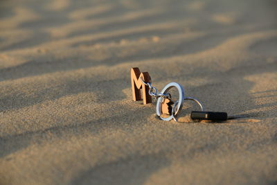 High angle view of shoes on sand