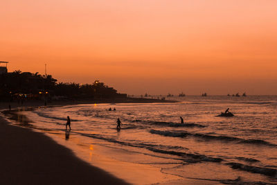 Scenic view of beach against sky during sunset