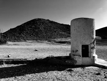 Built structure on land against sky