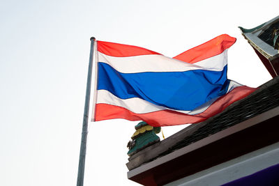 Low angle view of flag against clear sky