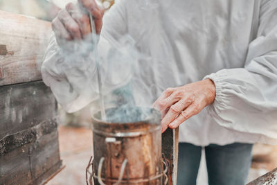 Midsection of man preparing food