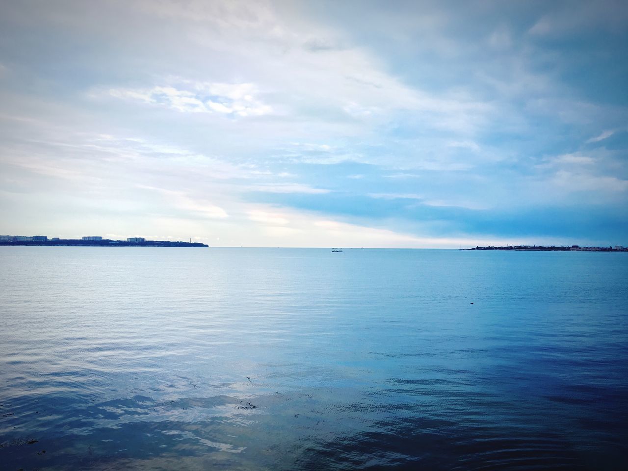 tranquility, sky, scenics, beauty in nature, water, tranquil scene, sea, cloud - sky, nature, outdoors, no people, idyllic, waterfront, day, horizon over water, blue