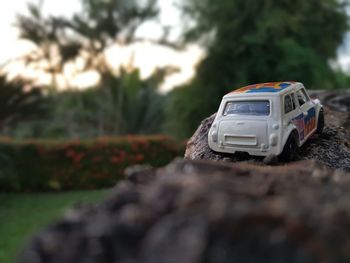 Close-up of toy car on rock