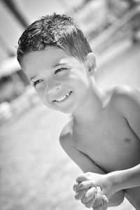 Grayscale of a cute little child in a swimming pool in summer