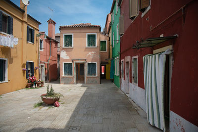 Alley amidst buildings in city