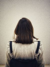 Rear view of woman carrying purse