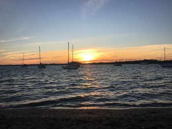 Scenic view of sea against sky at sunset