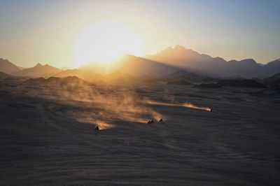 Scenic view of mountains against sky during sunset