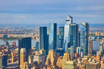 Modern buildings in city against sky