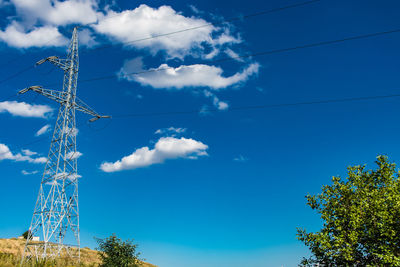 Low angle view of communications tower against sky