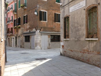 Empty alley amidst buildings in town