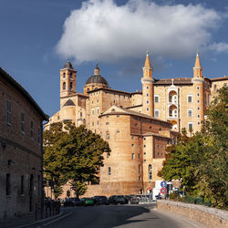 Buildings in city against sky