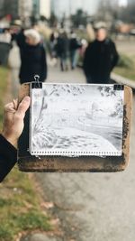 Close-up of man holding paper
