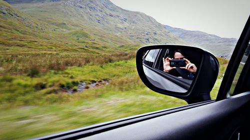 Cropped image of car on road