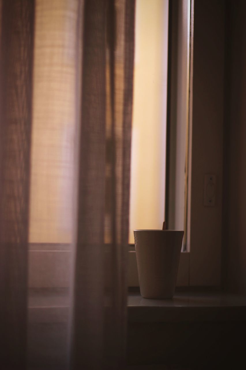 CLOSE-UP OF WINDOW ON TABLE AT HOME
