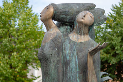 Statue against trees in park