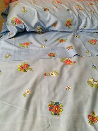 High angle view of yellow flowers on bed