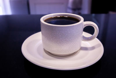 Close-up of coffee cup on table