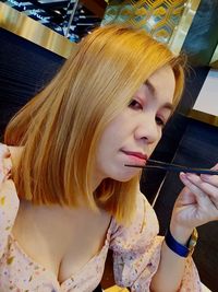 Portrait of young woman looking at camera