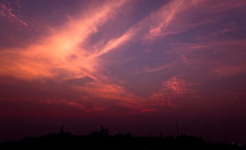 Silhouette landscape against scenic sky