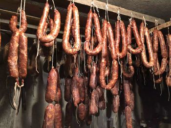 Meat hanging on barbecue grill