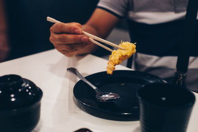 Midsection of person preparing food