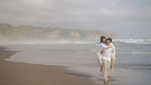 Full length of woman on beach