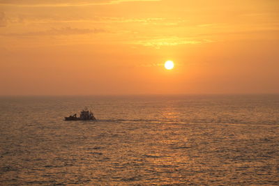 Scenic view of sunset over calm sea