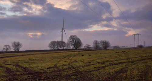 Scenic view of field against sky during sunset