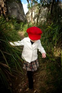 Rear view of man standing on field