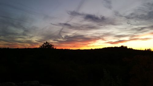 Silhouette of landscape against dramatic sky