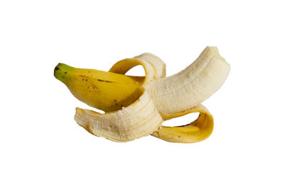 Close-up of yellow fruit against white background