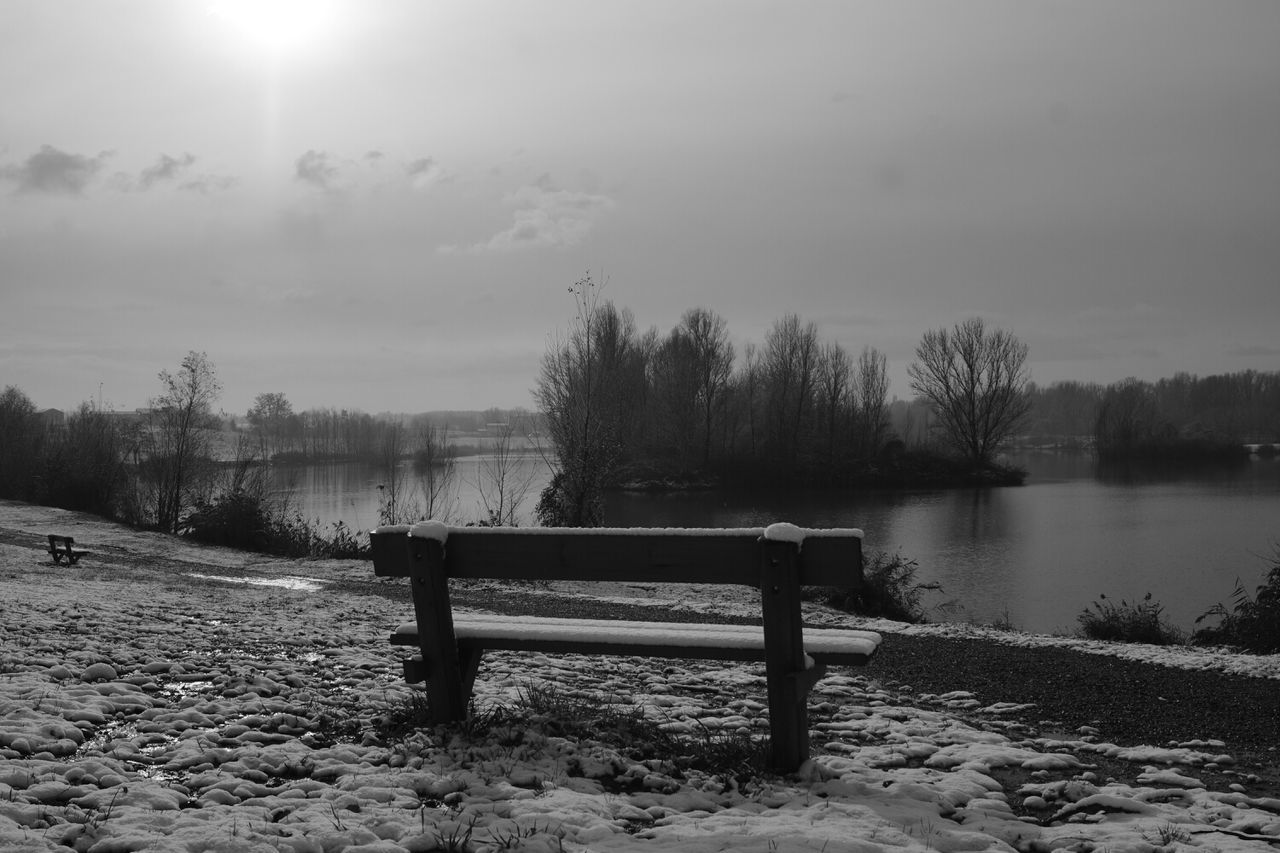 water, tranquility, tranquil scene, lake, tree, sky, scenics, nature, beauty in nature, bench, lakeshore, absence, bare tree, empty, cloud - sky, non-urban scene, idyllic, river, outdoors, reflection