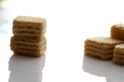 Close-up of stack on plate against white background