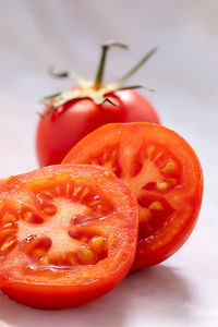 Close-up of tomatoes on white background