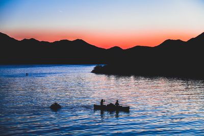 Scenic view of lake at sunset
