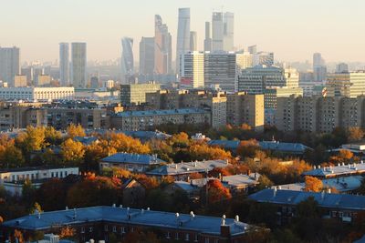 High angle view of trees and buildings against sky