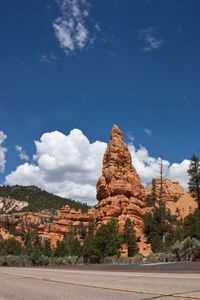 Scenic view of mountain against blue sky