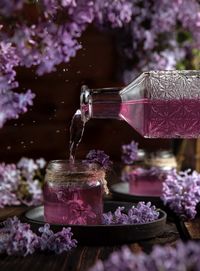 Close-up of pouring lilac syrup 