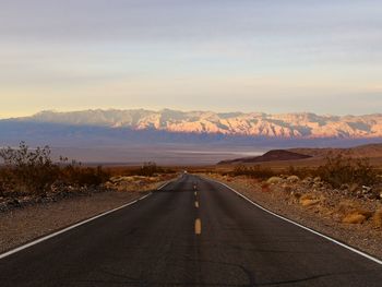 Empty road against sky