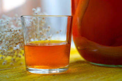 Close-up of orange juice on table